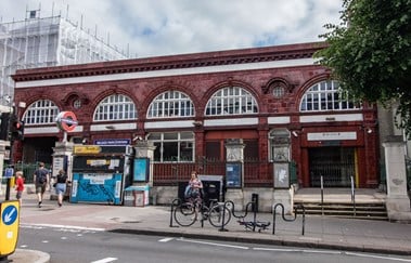 Red-tiled exterior of station.