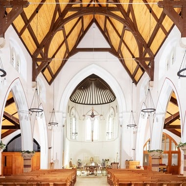 Anglican church c1870 and photographed post fire to show new roof and conserved arches and re-worked rose windows.Interior, view from east showing nave, chancel and new roof structure.