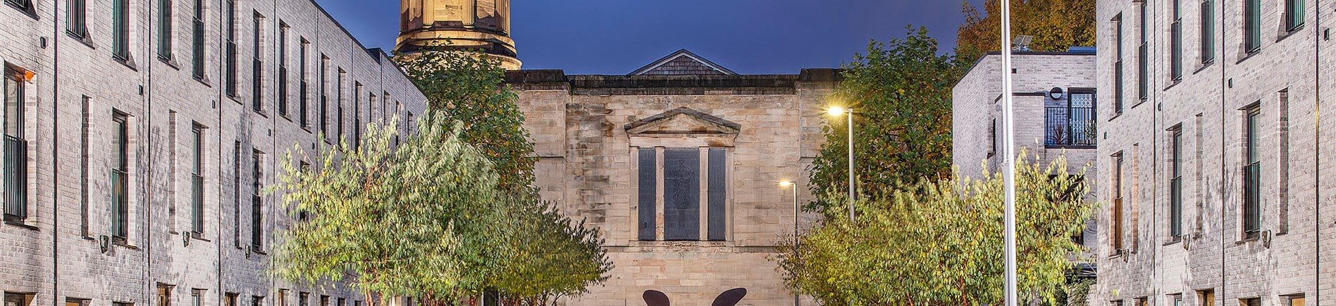 A view of a square of buildings which combines modern and historic buildings