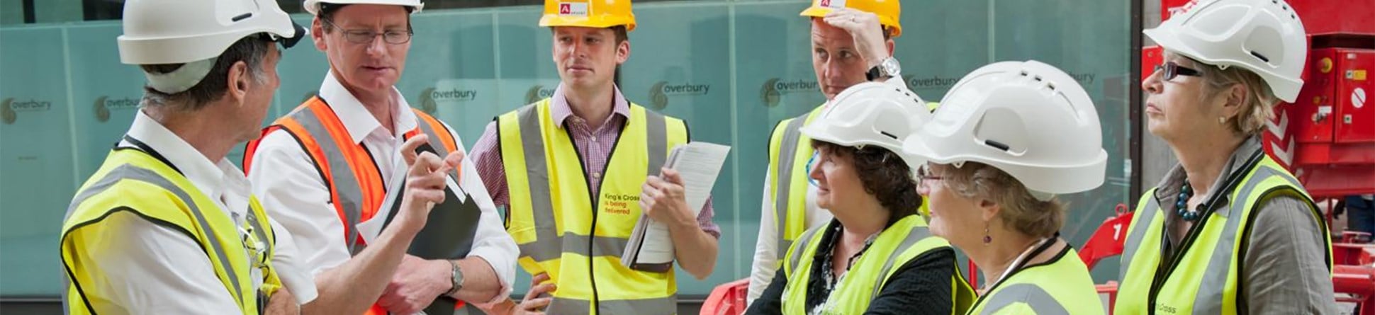 A group of experts meeting a project manager on-site