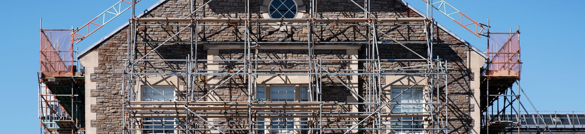 A Victorian office building with scaffolding.