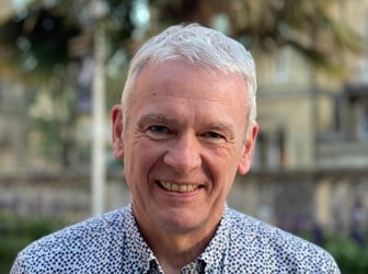 A head and shoulders portrait photograph of Martin Polley