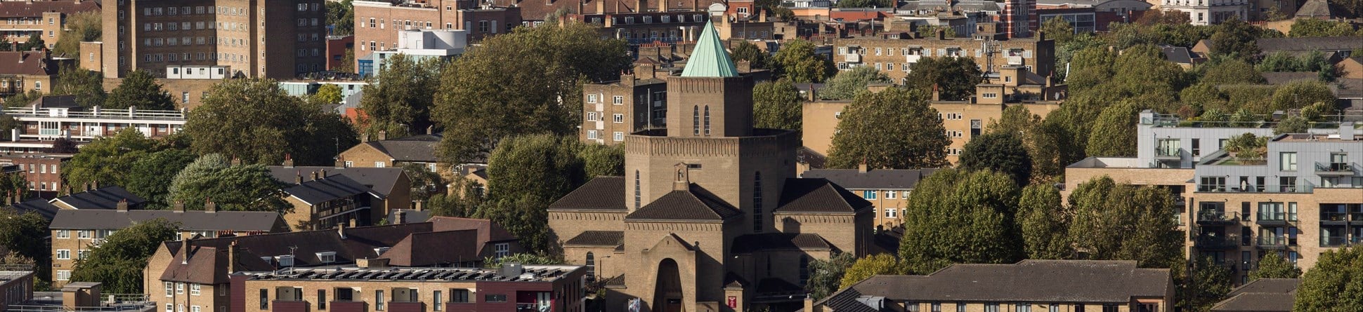 View across London rooftops to the central London skyline beyond.